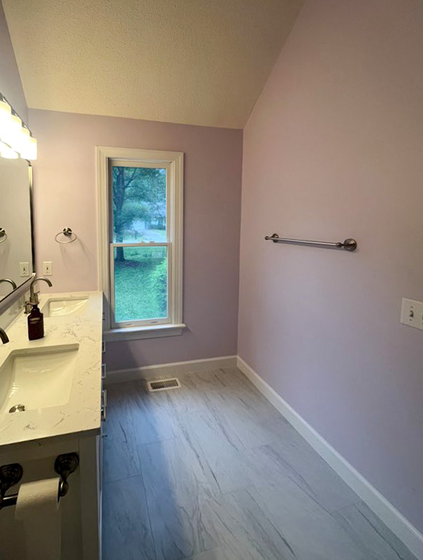 Bathroom remodel with double vanity and tile flooring
