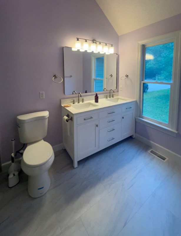 Bathroom remodel with double vanity and toilet view