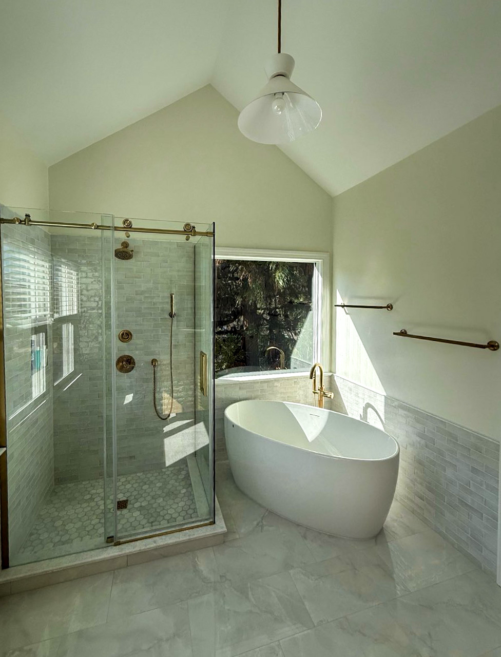 Luxury bathroom remodel with freestanding tub and glass shower