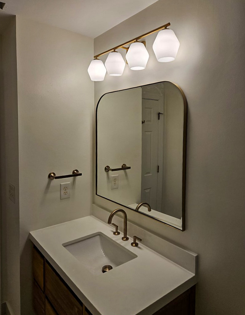 Modern bathroom vanity close-up with brass faucet