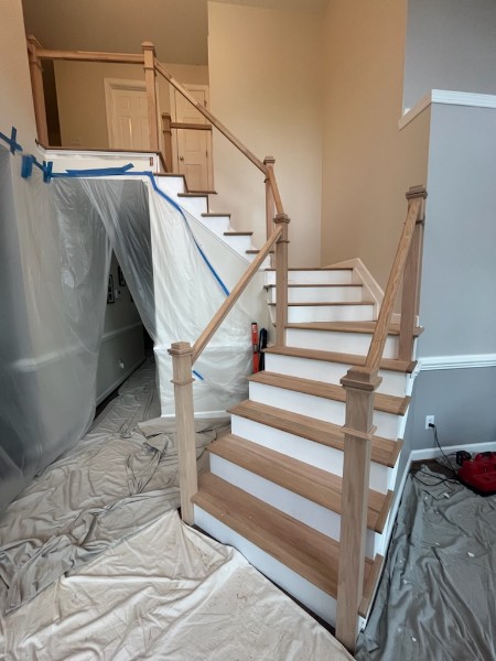 Staircase remodel with refinished wood treads and railings